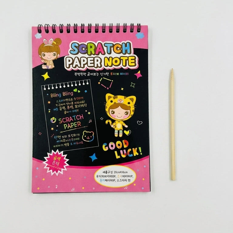 A spiral-bound Scratch Paper Note pad with a pink and black cover, shown on a light gray background next to a wooden pencil.