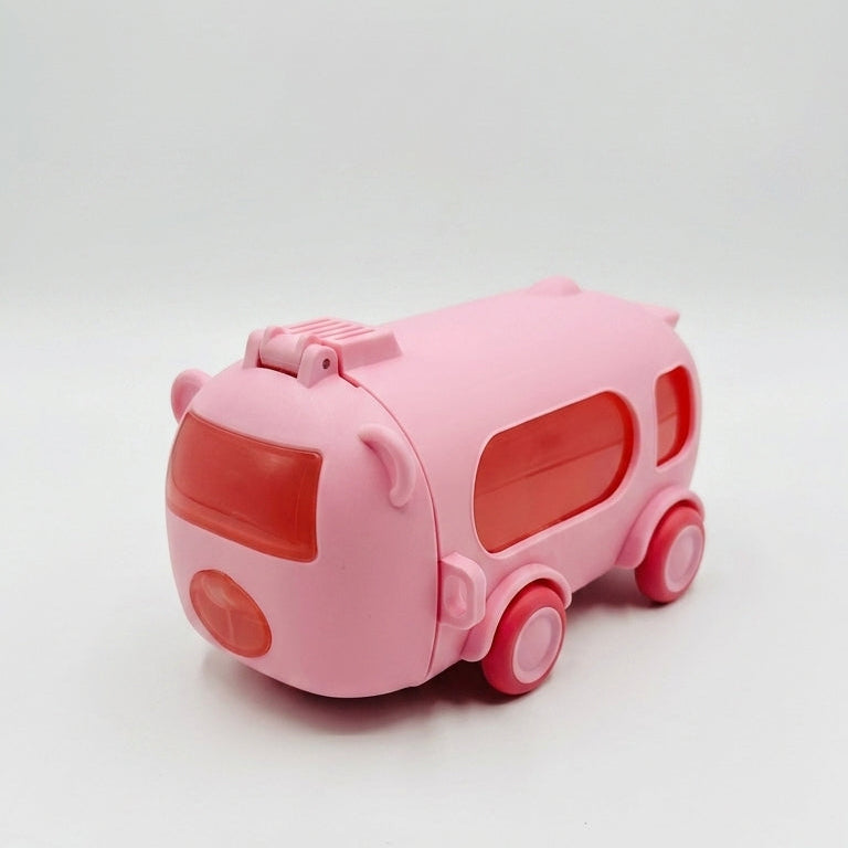 A small pink toy bus with red accents, photographed on a plain light gray studio background.