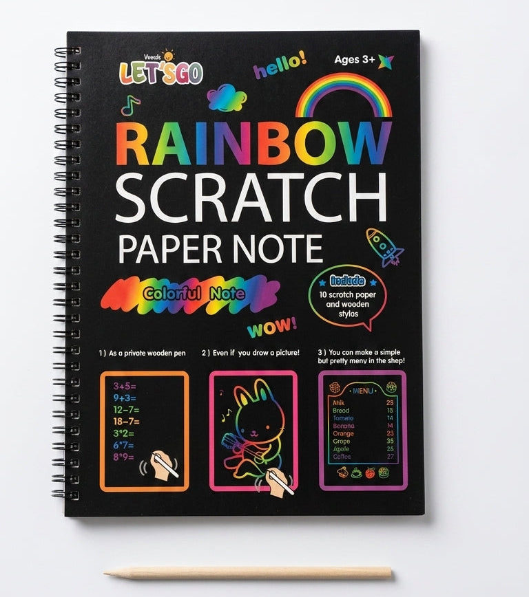 A spiral-bound black notebook labeled 'RAINBOW SCRATCH PAPER NOTE' with colorful graphics and text, shown on a light gray background with a wooden pencil below it.